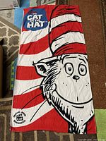 Full view of Cat in the Hat towel showing design and size reference