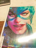 Front cover upper section showing Catwoman portrait and DC logo