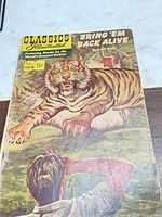 Front cover of Classics Illustrated No. 104 Bring 'Em Back Alive comic showing tiger illustration and price.