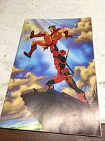 Front cover showing Deadpool holding Wolverine variant artwork
