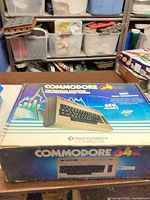 Retail box top showing Commodore 64 branding and image of computer