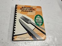 Front cover showing title, graphic design and comb binding