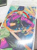 Front view of bagged comic showing full variant cover artwork