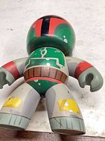 Front view of vinyl Boba Fett style figure showing torso, limbs and armor paint wear