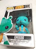 Front view of boxed Greedo Pop! showing figure and series branding
