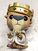 Front view of lion figure showing crown, robe and rings