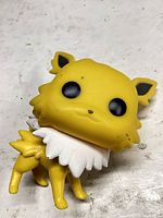 Front view of Jolteon Funko Pop showing facial paint scuffs