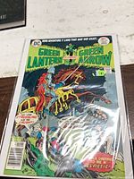 Front cover of Green Lantern / Green Arrow #92 in plastic sleeve with board