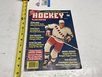 Front cover showing title, date and featured player