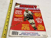 Front cover showing title, season, feature headlines, Mike Bossy photo