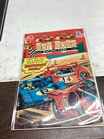 Front view of bagged Hot Rods and Racing Cars #112 comic