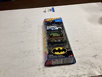 Front angled view of sealed Batman 5-pack showing vehicles and logo