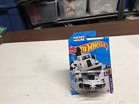 Front view of sealed Hot Wheels Disney Steamboat on blister card