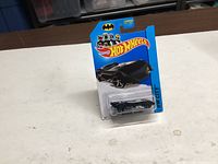 Front view of sealed Hot Wheels Batmobile on card