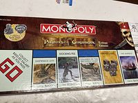 Box lid showing Monopoly Pirates of the Caribbean Trilogy Edition branding