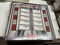 Front of square plaque displaying Foreigner "Records" album art