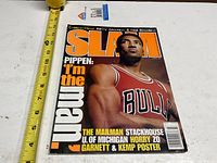 Front cover of SLAM March 1996 magazine with tape measure for scale