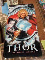 Full view of Thor graphic towel showing design and text
