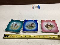Front view of three porcelain dishes showing size and designs