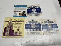 Overall shot of coronation packet and three individual View-Master reel sleeves on table