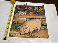 Front cover with tape measure showing size