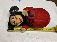 Mickey Mouse roly-poly toy full view with tape measure showing length