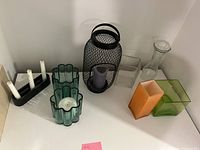 Group shot showing all candle holders and colored vases