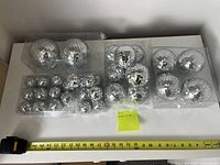 All disco balls removed from box and lined up by size