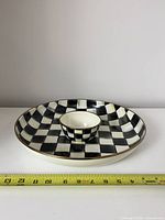 Top view of platter with dip cup centered; measuring tape shows diameter