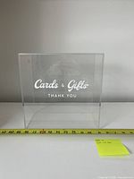Front view of clear acrylic card box with vinyl text