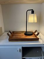 Tray and lamp together on shelf