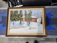 Full view of framed winter landscape painting