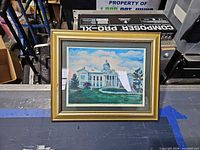 Front view of framed print showing artwork, mat and gold frame