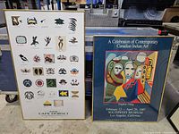 Front view of both framed posters standing side by side
