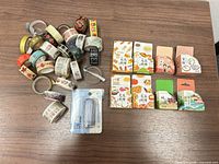 Loose assorted washi tape rolls, boxed sealed rolls, and tape cutter arranged on tabletop
