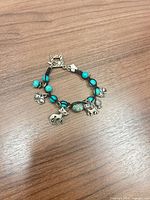Bracelet laid flat showing charms and beads