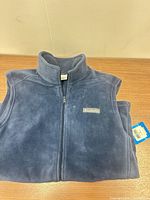 Front view of blue Columbia fleece vest