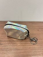 Front angled view of iridescent keychain pouch