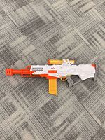 Full left-side view of Nerf Ultra Pharaoh blaster with magazine and scope attached