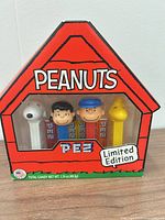 Front of sealed PEZ Peanuts box showing four dispensers