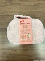 Front view of pink sherpa travel bag with product sleeve