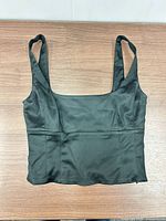 Front view of black cropped tank top