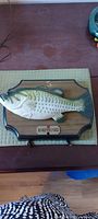 Front view of Big Mouth Billy Bass plaque on table
