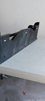 Underside view showing dowel bar and scrolled side