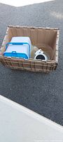 Tote containing plastic food container, clear glass punch bowl, mesh strainer