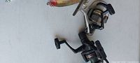 Two spinning reels and spoon lure