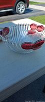 Ribbed clear glass bowl with pink leaves