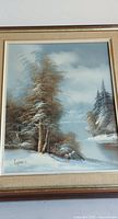 full view of framed winter landscape painting