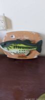 Green bass on plaque, front view