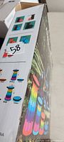 Box showing product images of rainbow telescopic stool